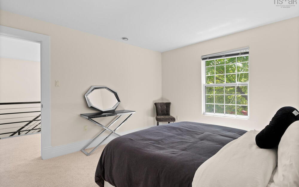 Bedroom with carpet flooring and baseboards