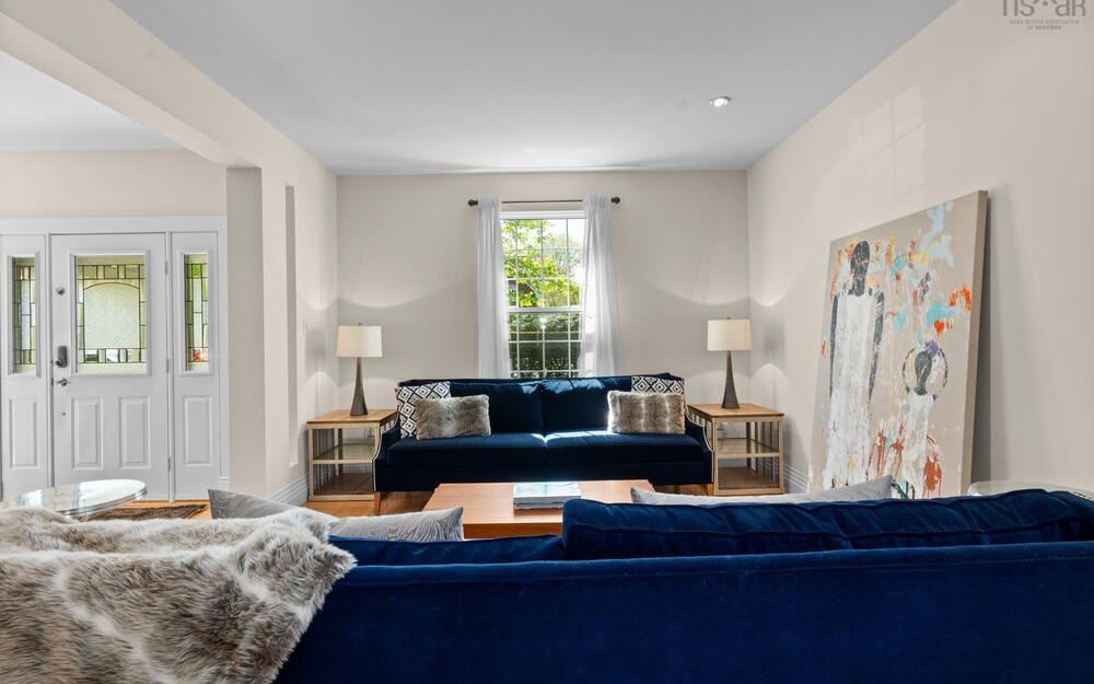 Living area featuring wood finished floors and baseboards