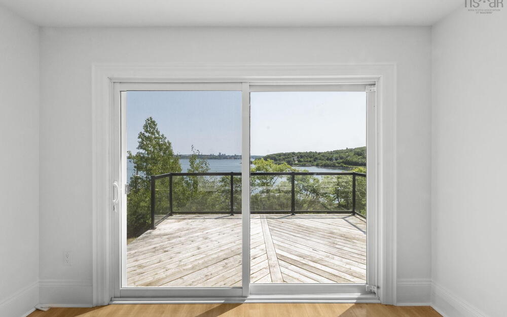 Entryway featuring a water view and wood finished floors